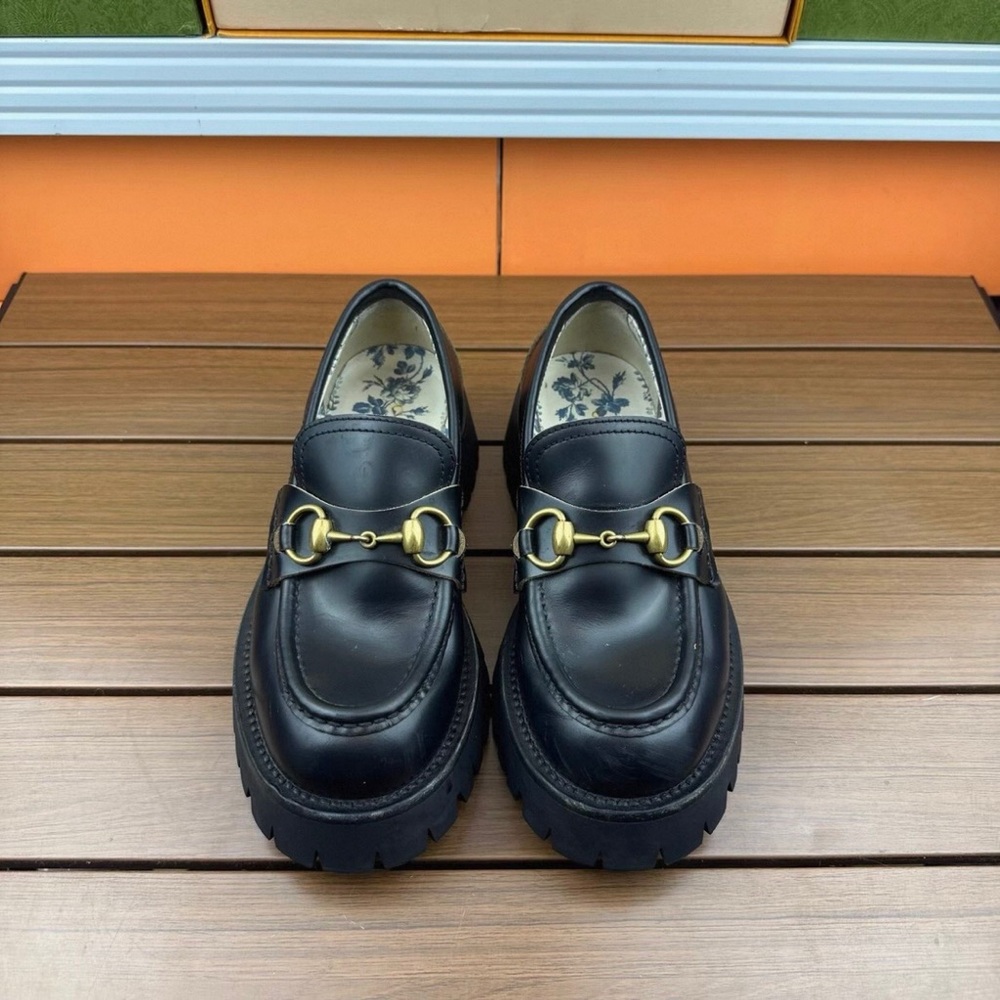 Gucci Black Loafers with Gold Detailing